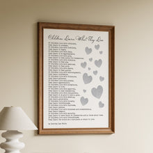 Load image into Gallery viewer, Framed "Children Learn What They Live" poem print by Dorothy Law Nolte with scattered blush pink hearts