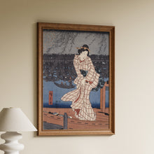 Load image into Gallery viewer, Evening on the Sumida River by Hiroshige, a woodblock print of a woman in a checked kimono on a riverboat beneath willow branches near Ryōgoku Bridge