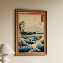 Load image into Gallery viewer, Hiroshige woodblock print of crashing blue waves on a rocky shore with Mount Fuji and a sailing boat in the distance