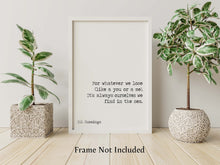 Load image into Gallery viewer, May include: A white framed print with a black and white poem by E.E. Cummings. The poem reads 'For whatever we lose (like a you or a me), It's always ourselves we find in the sea.' The print is displayed on a white wall with two potted plants on either side. The text 'Frame Not Included' is printed below the print.