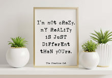 Load image into Gallery viewer, Cheshire Cat Quote Print – “I’m Not Crazy” Wall Art, Alice in Wonderland Decor, Book Nook Decor, Black and White Book Shelf Decor, Book Nook