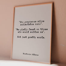 Load and play video in Gallery viewer, Addams Family Quote Print – “We Gladly Feast on Those Who Would Subdue Us” Morticia Addams Wall Art – Gothic Black & White Latin Poster