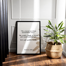 Load image into Gallery viewer, Addams Family Quote Print – “We Gladly Feast on Those Who Would Subdue Us” Morticia Addams Wall Art – Gothic Black &amp; White Latin Poster
