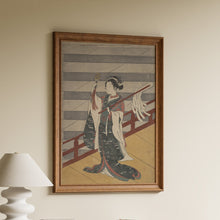 Load image into Gallery viewer, Suzuki Harunobu woodblock print of a Shinto shrine maiden in a kimono dancing with bells and paper streamers on a red-railed veranda
