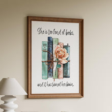 Load image into Gallery viewer, May include: A framed print featuring a watercolor illustration of a stack of books tied together with twine and a rose. The text reads, "She is too fond of books, and it has turned her brain."
