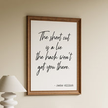 Load image into Gallery viewer, The short cut is a lie, the hack won’t get you there, Jocko Willink quote in black script on a white background in a wooden frame
