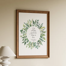 Load image into Gallery viewer, Let all that you do be done in love, 1 Corinthians 16:14, in black script inside a watercolour green leaf wreath on a white background
