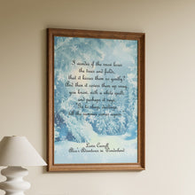 Load image into Gallery viewer, Framed Lewis Carroll quote print "I wonder if the snow loves the trees and fields" over a snowy winter woodland illustration
