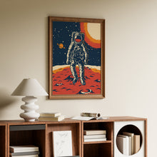 Load image into Gallery viewer, Retro astronaut standing on a red cratered planet with a ringed planet and glowing orange sun in a starry sky, in a wooden frame

