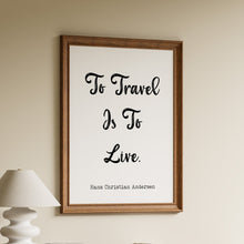 Load image into Gallery viewer, To Travel Is To Live quote by Hans Christian Andersen in bold black script on a white background in a wooden frame
