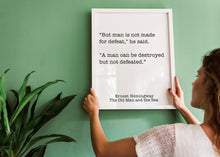 Load image into Gallery viewer, Ernest Hemingway Quote - Man is not made for defeat, A man can be destroyed but not defeated - Black and White book lover Print for library
